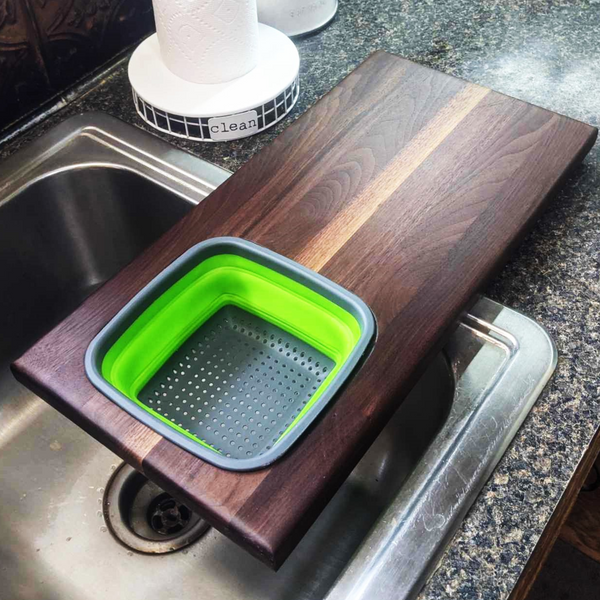 Over The Sink Black Walnut Edge Grain Cutting Board with Colander and Clear Rubber Grip Feet