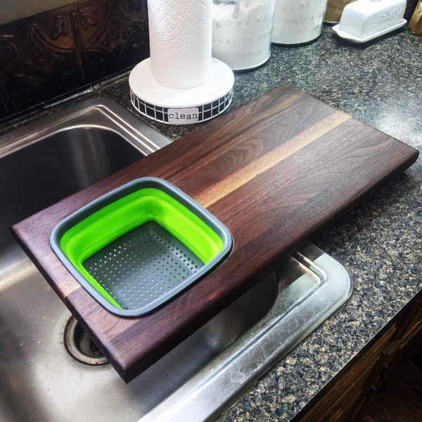 Over The Sink Black Walnut Edge Grain Cutting Board with Colander and Clear Rubber Grip Feet