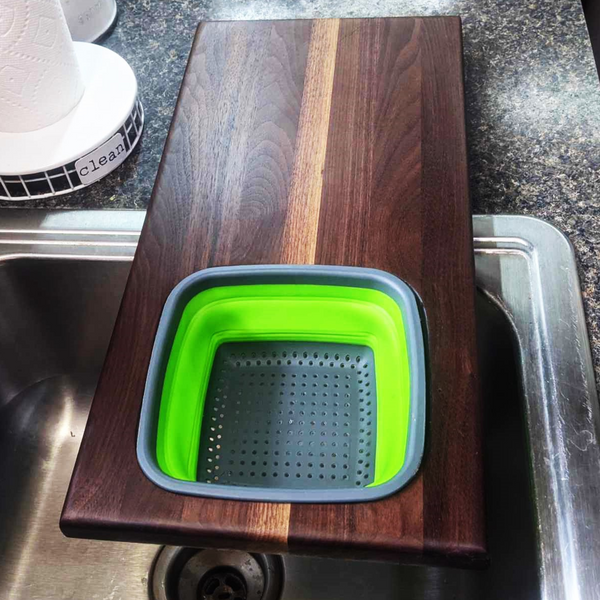 Over The Sink Black Walnut Edge Grain Cutting Board with Colander and Clear Rubber Grip Feet