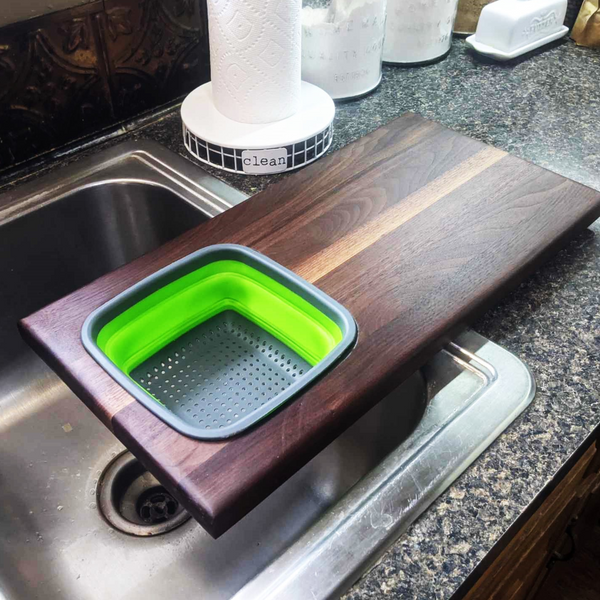 Over The Sink Black Walnut Edge Grain Cutting Board with Colander and Clear Rubber Grip Feet