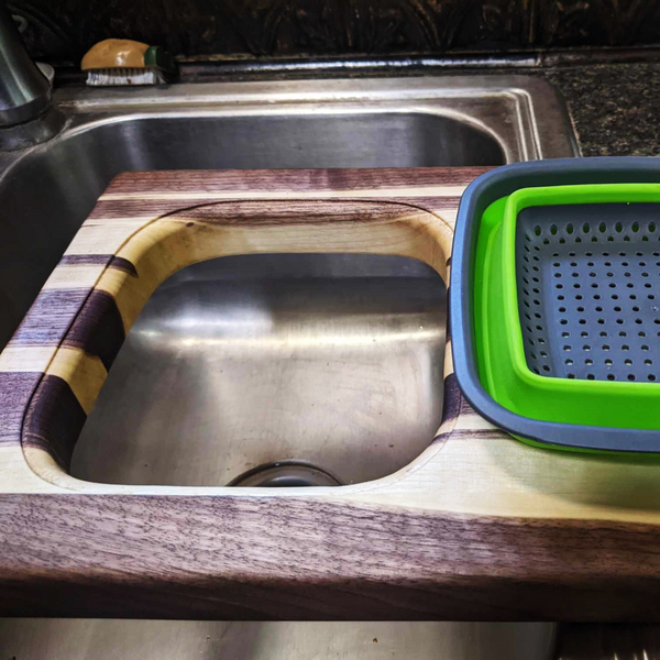 Large Over The Sink Black Walnut Edge Grain Cutting Board with Colander and Clear Rubber Grip Feet