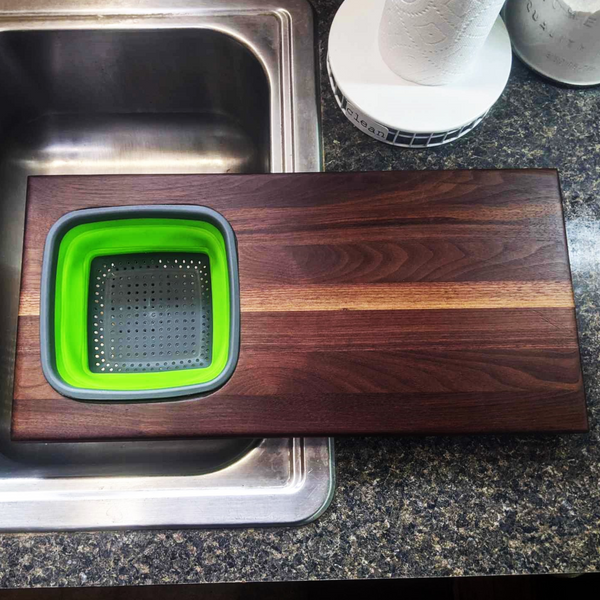 Over The Sink Black Walnut Edge Grain Cutting Board with Colander and Clear Rubber Grip Feet