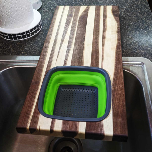 Large Over The Sink Black Walnut Edge Grain Cutting Board with Colander and Clear Rubber Grip Feet