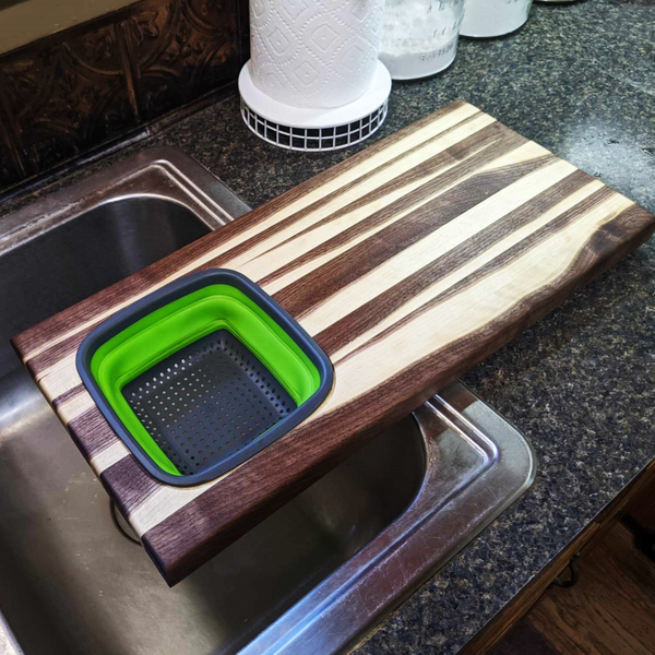 Large Over The Sink Black Walnut Edge Grain Cutting Board with Colander and Clear Rubber Grip Feet