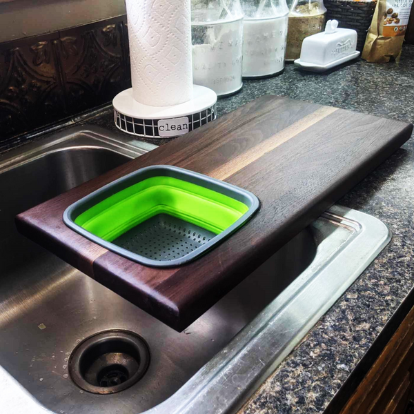 Over The Sink Black Walnut Edge Grain Cutting Board with Colander and Clear Rubber Grip Feet