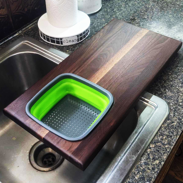 Over The Sink Black Walnut Edge Grain Cutting Board with Colander and Clear Rubber Grip Feet