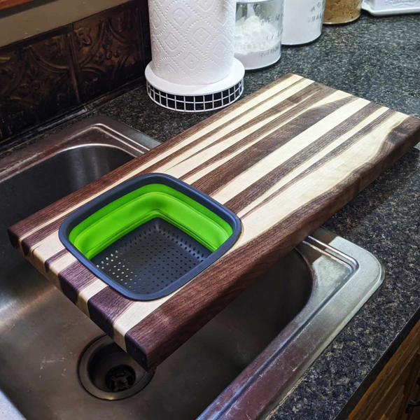 Large Over The Sink Black Walnut Edge Grain Cutting Board with Colander and Clear Rubber Grip Feet