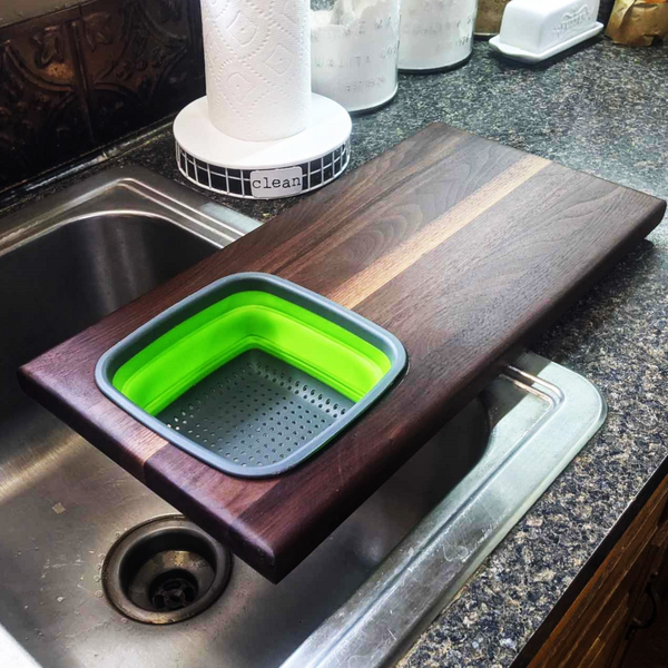 Over The Sink Black Walnut Edge Grain Cutting Board with Colander and Clear Rubber Grip Feet