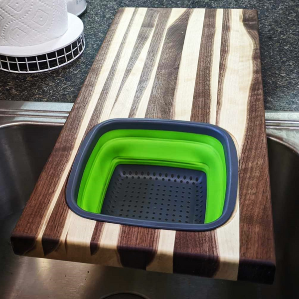 Large Over The Sink Black Walnut Edge Grain Cutting Board with Colander and Clear Rubber Grip Feet