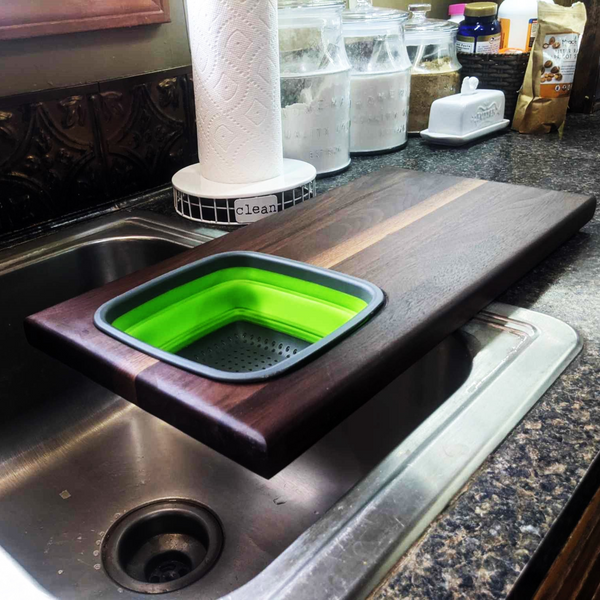 Over The Sink Black Walnut Edge Grain Cutting Board with Colander and Clear Rubber Grip Feet