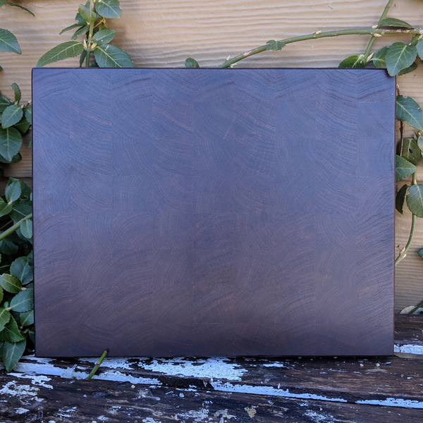Black walnut end grain cutting board on kitchen counter