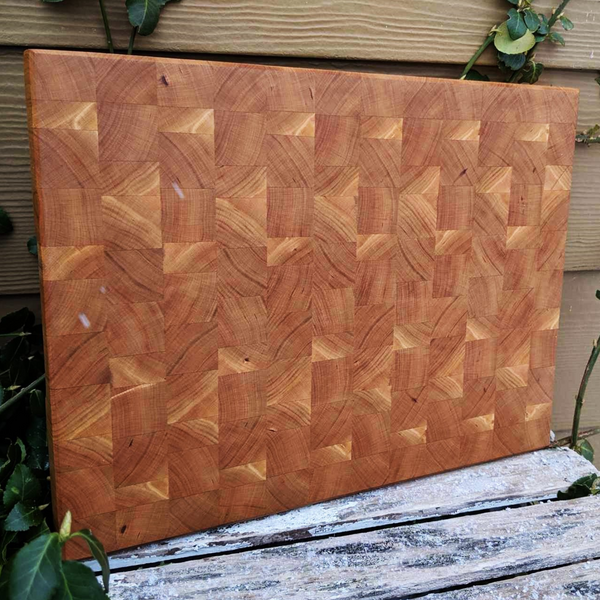Side angled shot showing beveled edge and thickness of cherry end grain board