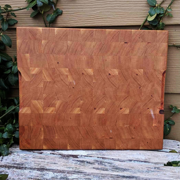 Close-up of hand-carved groove on side of cherry end grain board