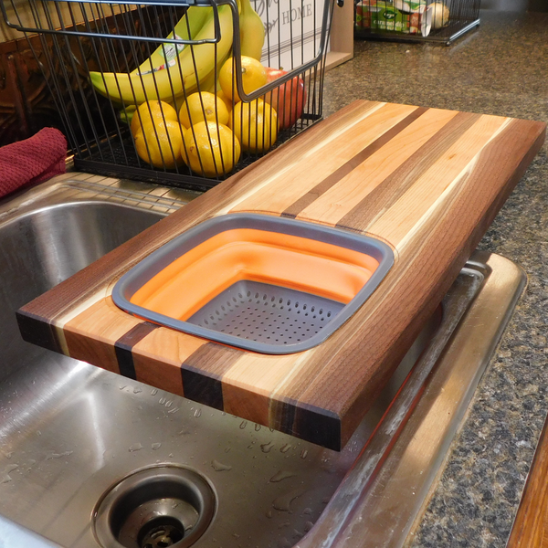 Large Over The Sink Black Walnut & Cherry Wood Edge Grain Cutting Board with Colander and Clear Rubber Grip Feet