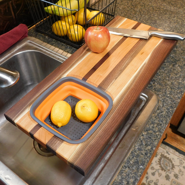 Large Over The Sink Black Walnut & Cherry Wood Edge Grain Cutting Board with Colander and Clear Rubber Grip Feet