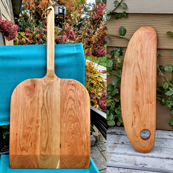 Handcrafted wood pizza peel and pizza cutter.