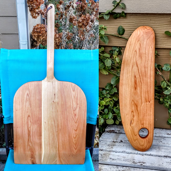 Handcrafted wood pizza peel and pizza cutter.