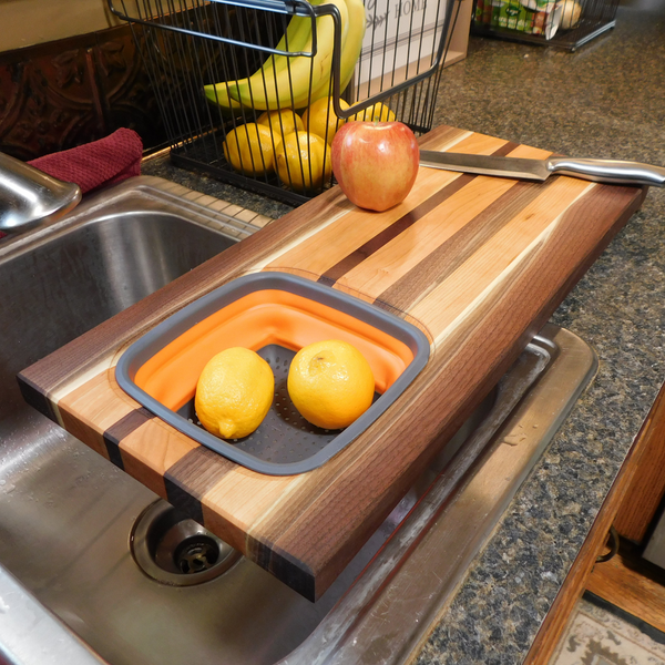Large Over The Sink Black Walnut & Cherry Wood Edge Grain Cutting Board with Colander and Clear Rubber Grip Feet