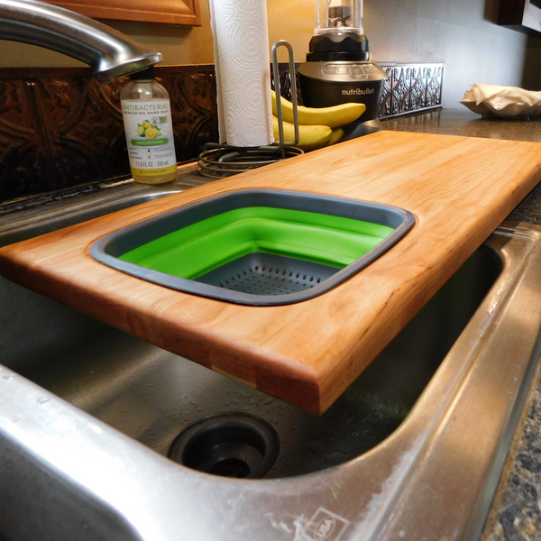Over The Sink Cherry Wood Edge Grain Cutting Board with Collapsible Colander and Clear Rubber Grip Feet