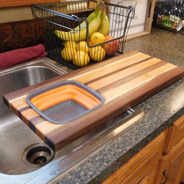 Large Over The Sink Black Walnut & Cherry Wood Edge Grain Cutting Board with Colander and Clear Rubber Grip Feet