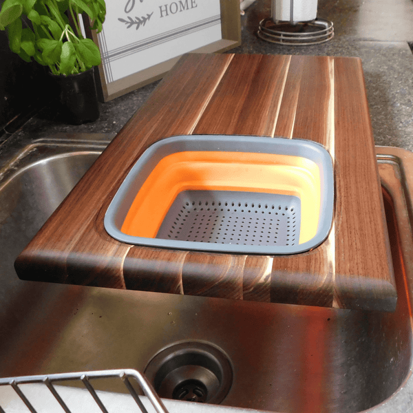 Large Over The Sink Black Walnut Edge Grain Cutting Board with Colander and Clear Rubber Grip Feet