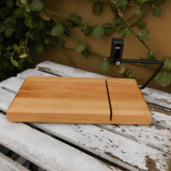 Butcher block cherry wood cheese slicing board, finished in a food grade oil and beeswax mixture to give it a beautiful sheen.