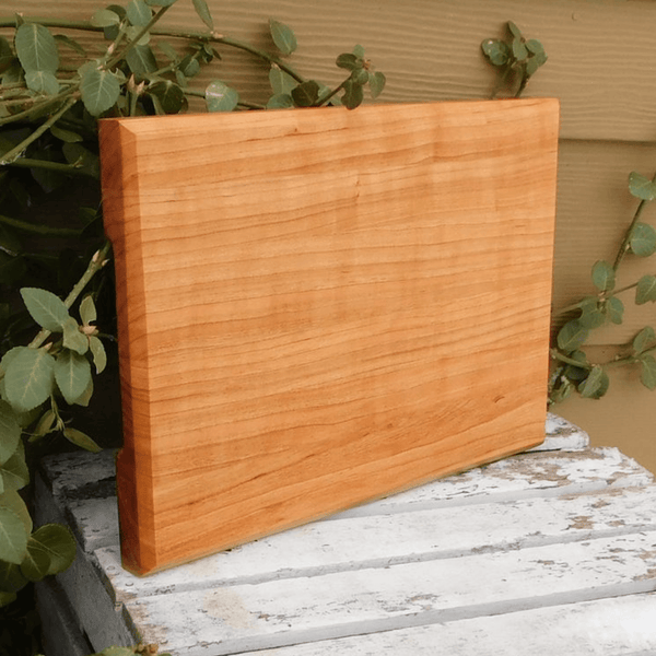 Cherry Wood edge grain cutting board with hand grooves on sides. Handmade in the USA by Springhill Millworks.