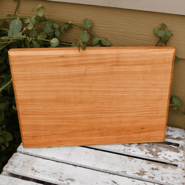 Cherry Wood edge grain cutting board with hand grooves on sides. Handmade in the USA by Springhill Millworks.