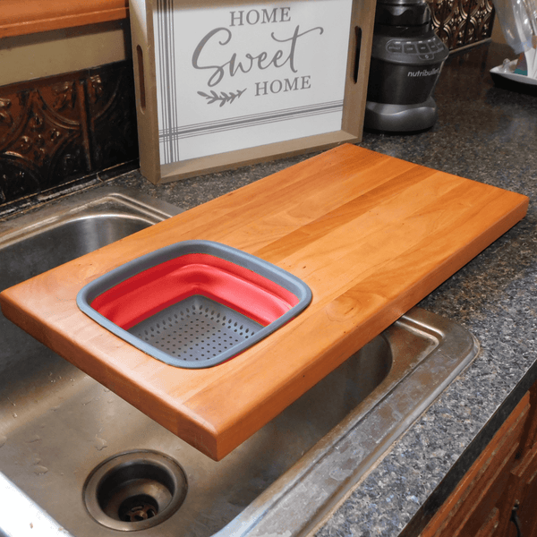 Over The Sink Cherry Wood Edge Grain Cutting Board with Collapsible Colander and Clear Rubber Grip Feet