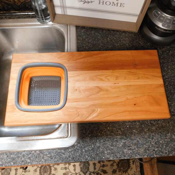 Over The Sink Cherry Wood Edge Grain Cutting Board with Collapsible Colander and Clear Rubber Grip Feet