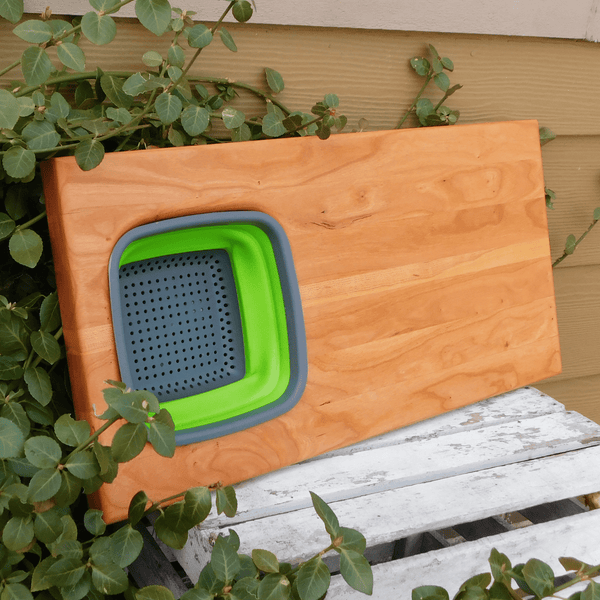 Over The Sink Cherry Wood Edge Grain Cutting Board with Collapsible Colander and Clear Rubber Grip Feet