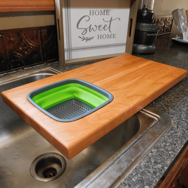 Over The Sink Cherry Wood Edge Grain Cutting Board with Collapsible Colander and Clear Rubber Grip Feet