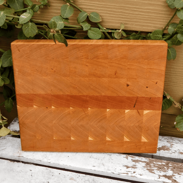 Cherry Wood end grain cutting board with beveled edge.