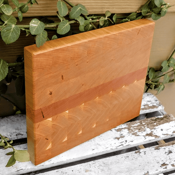 Cherry Wood end grain cutting board with beveled edge.