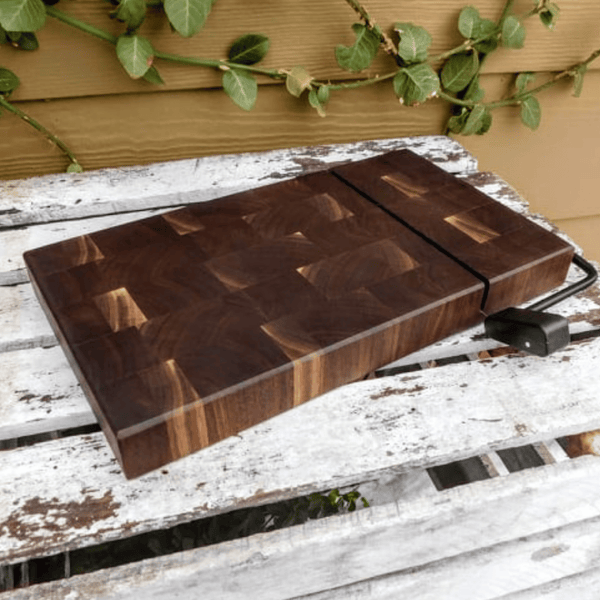 Black Walnut end grain wooden cheese slicing cutting board.