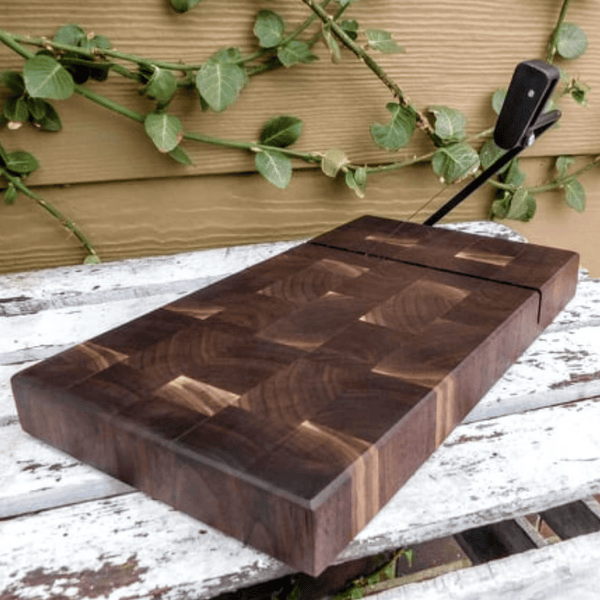 Black Walnut end grain wooden cheese slicing cutting board.