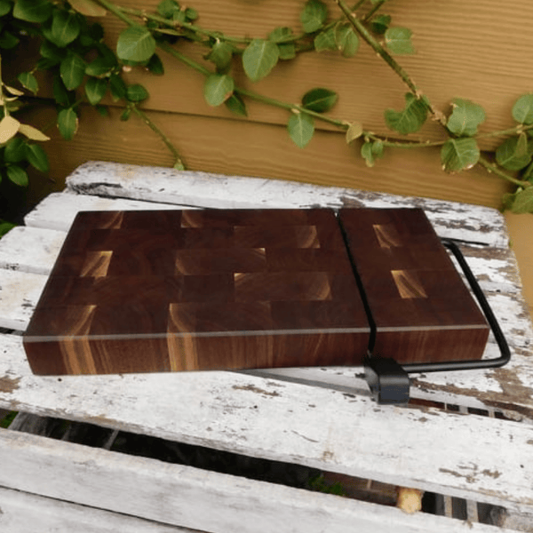 Black Walnut end grain wooden cheese slicing cutting board.