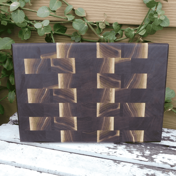 Black Walnut end grain cutting board with beveled edge, finished in a food grade oil and beeswax mixture. Handmade in the USA by Springhill Millworks.