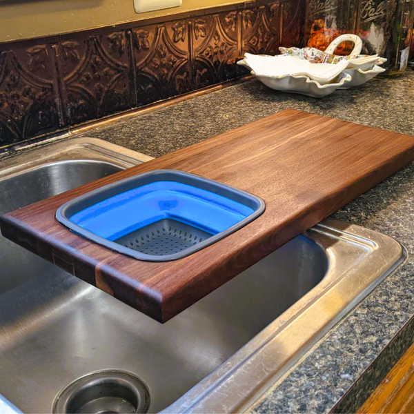 Over The Sink Black Walnut Edge Grain Cutting Board with Colander and Clear Rubber Grip Feet