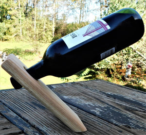 Floating wood wine bottle holders.