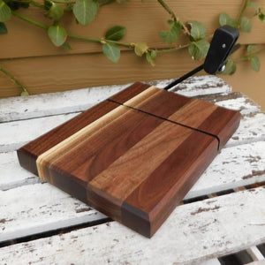 Black Walnut and Cherry Wood cheese slicing cutting boards.
