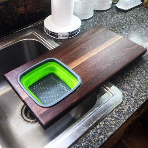 Over The Sink Black Walnut Edge Grain Cutting Board with Colander and Clear Rubber Grip Feet