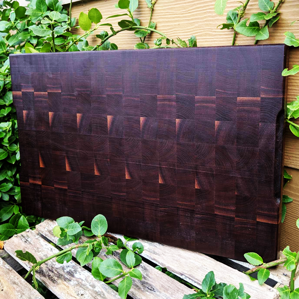 Large Black Walnut End Grain Cutting Board with Hand Grooves and a Beveled Edge.