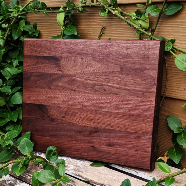 Black Walnut Wood Edge Grain Cutting Board with Beveled Edge & Rubber Grip Feet.