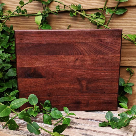 Black Walnut Wood Edge Grain Cutting Board with Beveled Edge & Rubber Grip Feet.