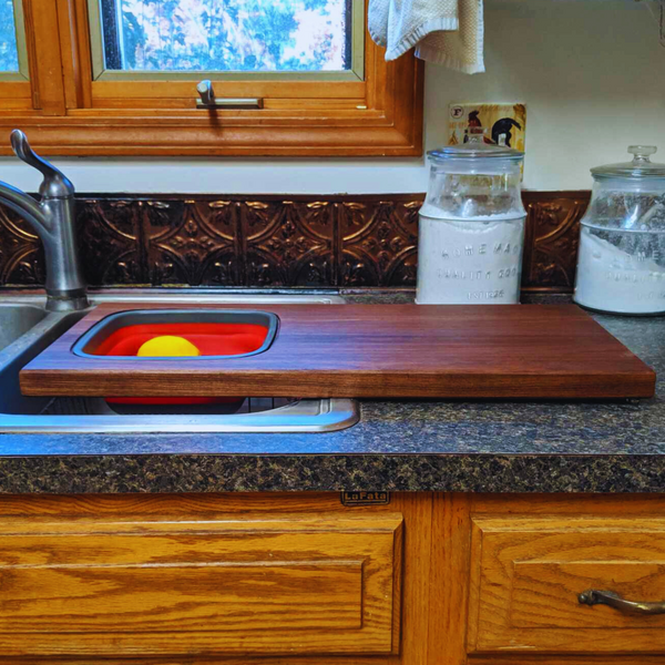 Large Over The Sink Black Walnut Edge Grain Cutting Board with Colander and Clear Rubber Grip Feet