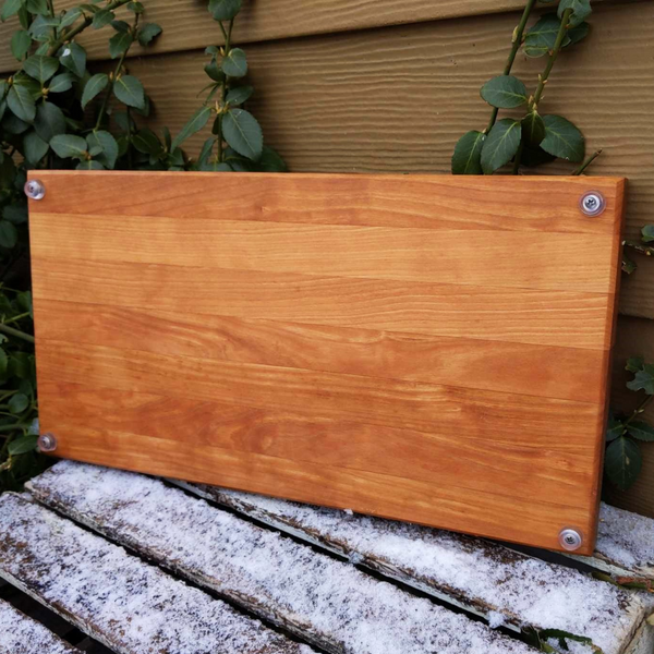 Cherry Wood Edge Grain Cutting Board with Clear Rubber Feet, Hand Grooves on Sides, & a Beveled Edge