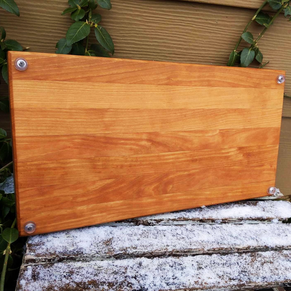 Cherry Wood Edge Grain Cutting Board with Clear Rubber Feet, Hand Grooves on Sides, & a Beveled Edge