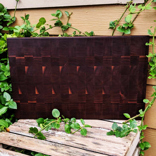 Large Black Walnut End Grain Cutting Board with Hand Grooves and a Beveled Edge.