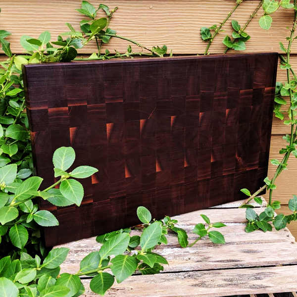 Large Black Walnut End Grain Cutting Board with Hand Grooves and a Beveled Edge.